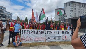 "Capitalism brings war, popular struggles build peace." Solidarity action with workers at Paris airport, June 2025. Source: BDS France-Paris/Facebook