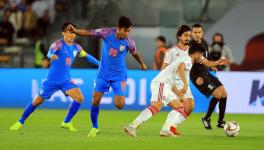 Indian football team players vie for the ball with UAE players at AFC Asian Cup