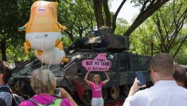 CodePink's Medea Benjamin poses in front a tank ahead of the "Salute to America" Fourth of July event with US President Donald Trump at the Lincoln Memorial on the National Mall in Washington, DC, on July 3, 2019. 