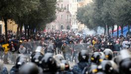 Demonstrators take part in a protest seeking to prevent MPs and government officials from reaching the parliament for a vote of confidence, in Beirut, Lebanon, February 11, 2020.