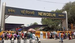 Stranded people rushing to New Delhi rail station to catch their train during fourth phase of the lockdown