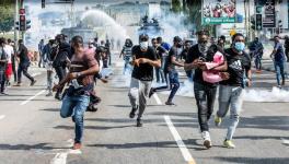 Nigerian protesters being chased by the police. File Photo (Business Day)