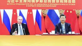 Chinese President Xi Jinping (R) met with Russian President Vladimir Putin via video link on December 15, 2001