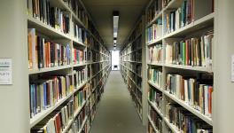 A view between two shelving aisles in the Bodleian Social Science Library