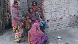 Leela with her family and fellow villagers