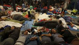 Syrian refugees having rest at the floor of Keleti railway station. Refugee crisis. Budapest, Hungary, Central Europe, 5 September 2015..jpg