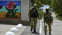 Two Russian soldiers patrolling in Kherson, south Ukraine