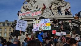 Climate change protesters march in Paris