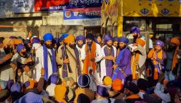 Waris Punjab De' founder Amritpal Singh along with his supporters arrive at the police station demanding release of his associate, at Ajnala near Amritsar, Thursday, Feb. 23, 2023 