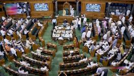 Opposition MPs protest in the Lok Sabha during the Monsoon session of Parliament, in New Delhi, Friday, July 28, 2023.