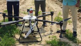 Preparation for spraying pesticides in fields with drones in a village in Hanumangarh district (Photo sourced by Amarpal Singh Verma, 101Reporters)