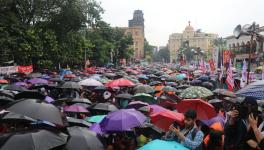 Rally amid the rains by Left-wing organisations SFI, DYFI, AIDWA at Dharmatala on September 26.