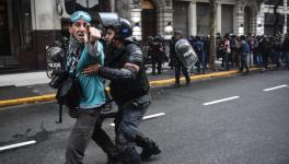 Police in Buenos Aires drag away a journalist. Photo: SiPreBa