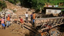 People repair a collapsed bridge affected by Cyclone Ditwah in Badulla District, Sri Lanka, Dec. 13, 2025. Photo: Xinhua