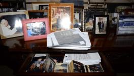 Desk drawer with printed pictures including Donald Trump with Jeffrey Epstein and Ghislaine Maxwell and Trump standing with women in swimwear. Photo: DOJ