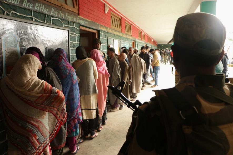 Voters waiting for their turn to cast their vote at Handwara