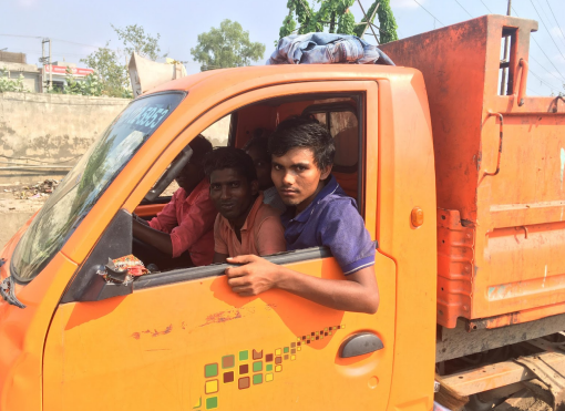 Chandu, 20 (in blue t-shirt), a rag picker from Bihar who works at Eco Green Energy earning about Rs. 200-300 per day.