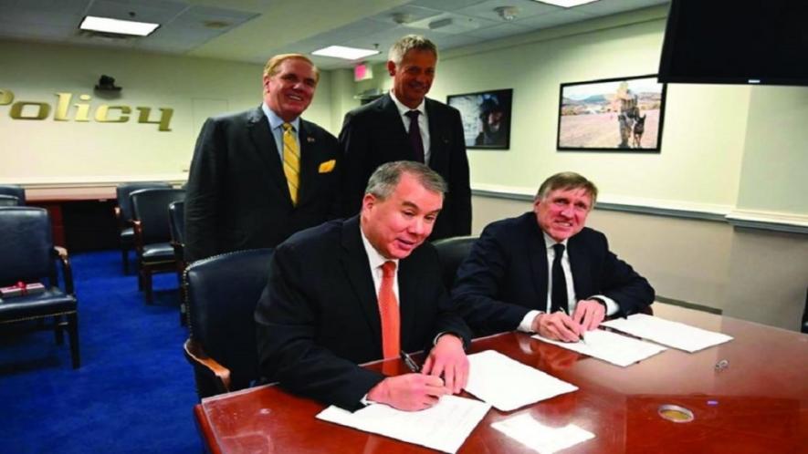 Luxembourg’s defense minister François Bausch and the US Undersecretary of Defense for Policy, John Rood, sign the agreements on space cooperation on January 14.