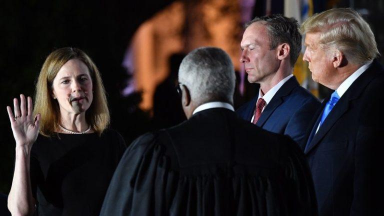 Amy Coney Barrett takes her first oath as an associate justice of the Supreme Court, hours after her controversial confirmation by the Senate (Photo: Nicholas Kamm/AFP)