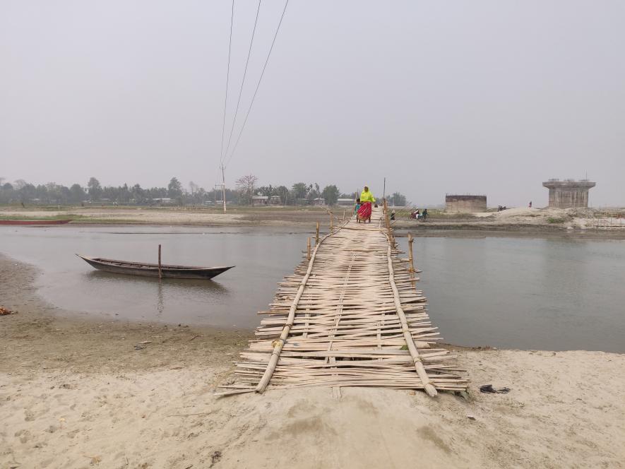 Kids have to cross these bamboo bridges to go to school