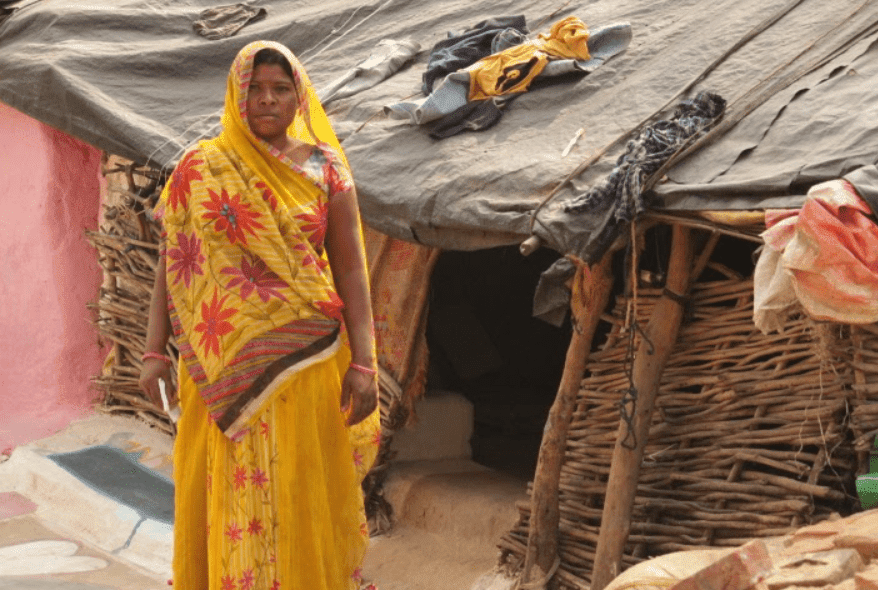 Usha Adivasi outside her hut in Angarha village of Tikamgarh district. Photo: Sneha Richhariya