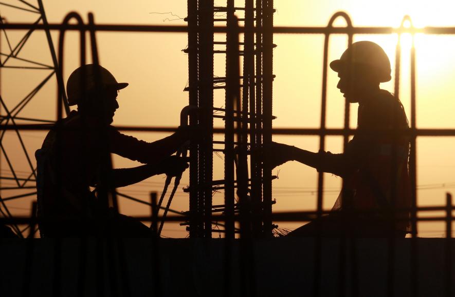 Labourers work at the Dwarka Expressway construction site