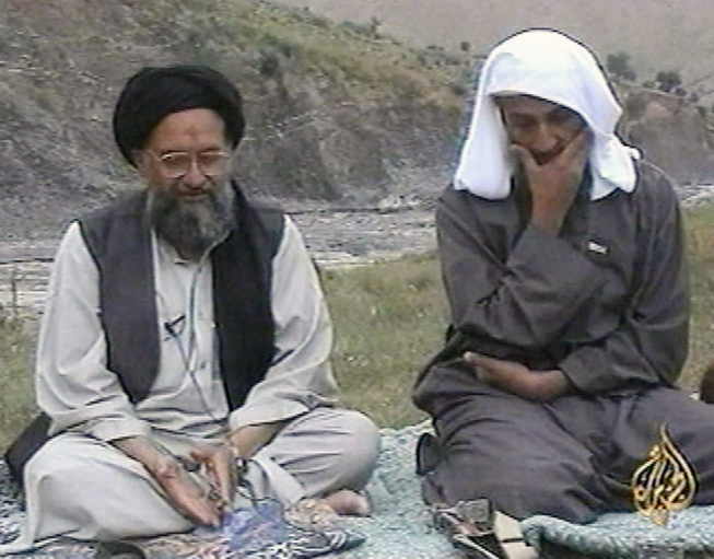 An Al-Jazeera TV image of Osama bin Laden (R)  listening as his top deputy Ayman al-Zawahri speaks at an undisclosed location circa 2002.