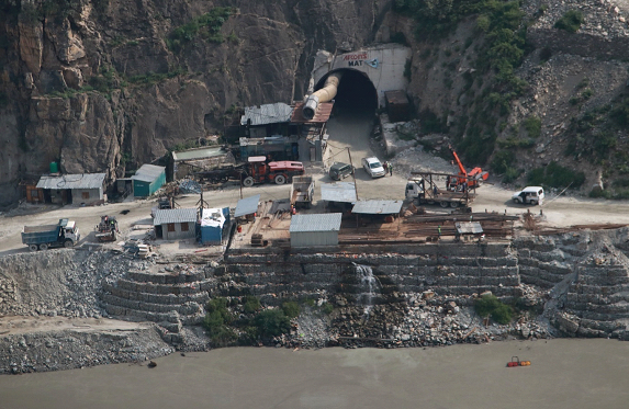 Heavy machines being used to build tunnels through the rugged mountains in Kishtwar while constructing hydropower projects on the Chenab. 