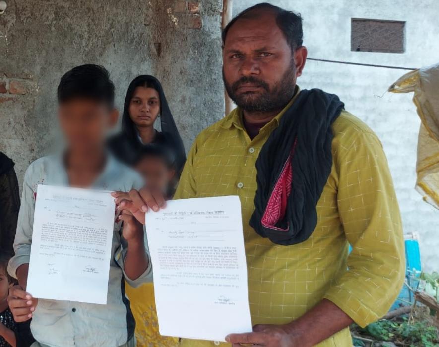 Kalu Khan with his wife and two children.