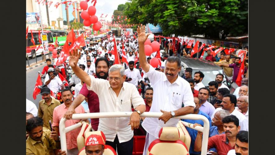 CPI(M) general secretary Sitaram Yechury and state secretary MV Govindan receive the guard of honour during a public meeting. Image Courtesy: CPI(M) Kerala.