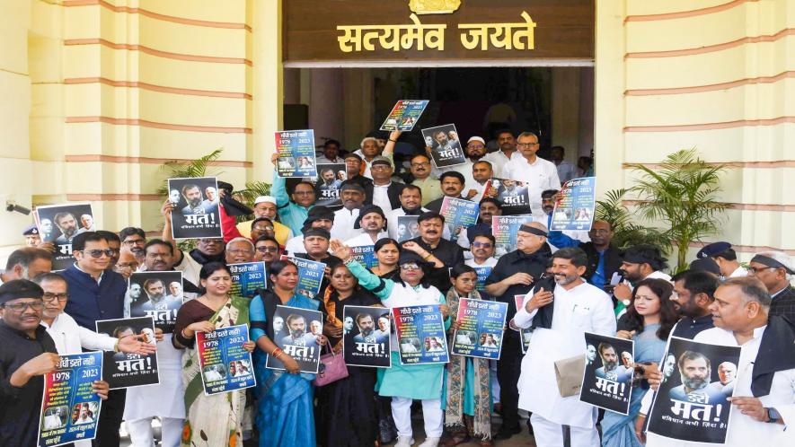 Grand Alliance legislators wearing black ribbons stage a protest against the Central Government over disqualification of Congress leader Rahul Gandhi from the Lok Sabha, during the Budget Session of Bihar Assembly, in Patna, Monday, March 27, 2023. image Courtesy: PTI