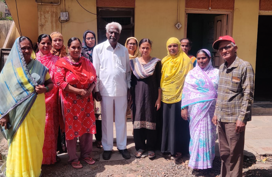  of the Belgaum District Beedi and Tobacco workers union along with the President, CA Kharade (Centre).