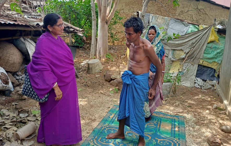 ASHA Mithu Choudhury talks to Gorachand Mandal, of Dabra village, Bankura.