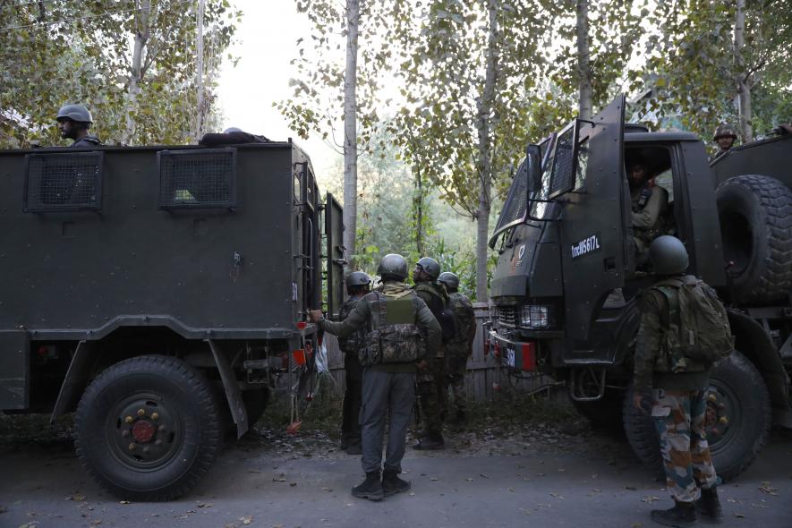 Army personnel assembled near the encounter site.