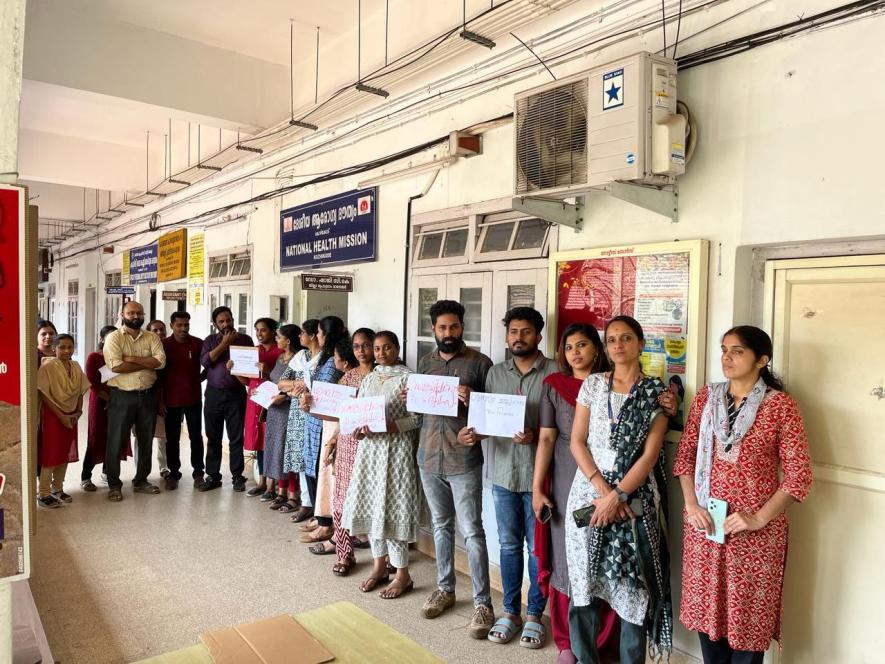 Workers hold placards with demands during the five-day struggle.