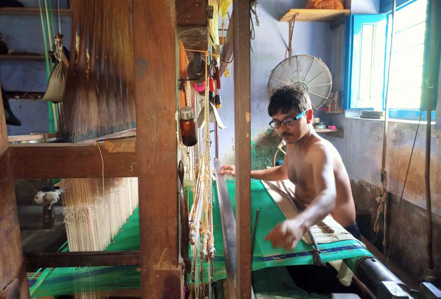 Baluchari saree artisan Haradhan Das makes sarees as a daily wage labourer at Vaishnabpara, Bishnupur.