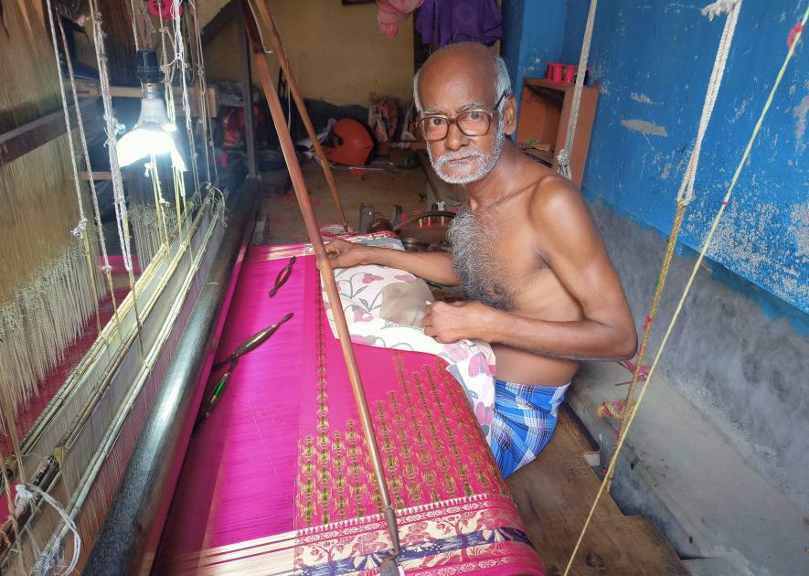 Elderly Baluchari artisan Shyamsundar Bit makes saree as a daily worker.