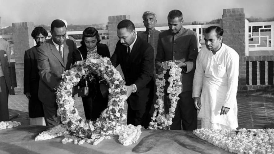 Rev. Martin Luther King Jr. lays a wreath at the Mahatma Gandhi Memorial, New Delhi. Photo via: Stanford University