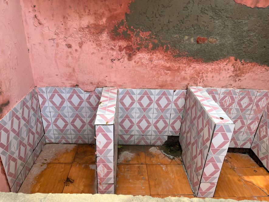 The girl's bathroom in the government school in Kasandi.