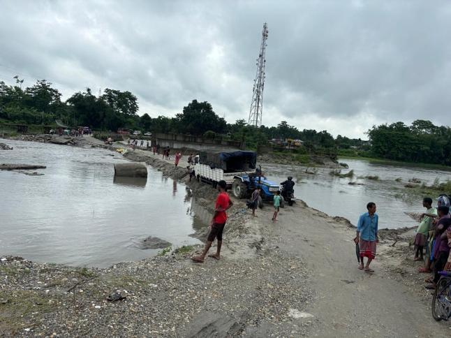 This land bridge in Alipurduar district barely holds during monsoons, highlighting the region’s crumbling infrastructure.