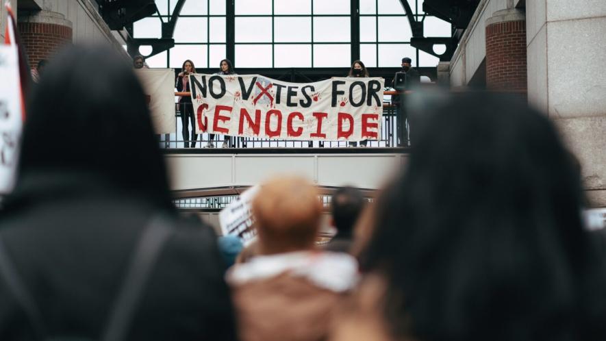 Protesters hang a banner reading "No votes for genocide" ahead of the US presidential elections in Boston, MA. The Israeli genocide in Gaza has become one of the defining issues of the elections. Photo: Micah Fong/PSL