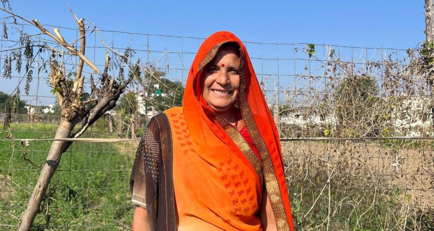 Gopibai Mali, 60, in front of her marigold fields in Emdi village of Rajsamand (Photo - Mansi Vijay, 101Reporters).