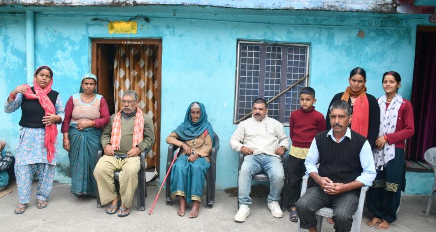 Khajani Devi’s family recalled carrying the centenarian (Centre, in blue) out on a palanquin in pitch darkness, with the river rising around them in September. They are now living in a neighbour’s home (Photos.jpg