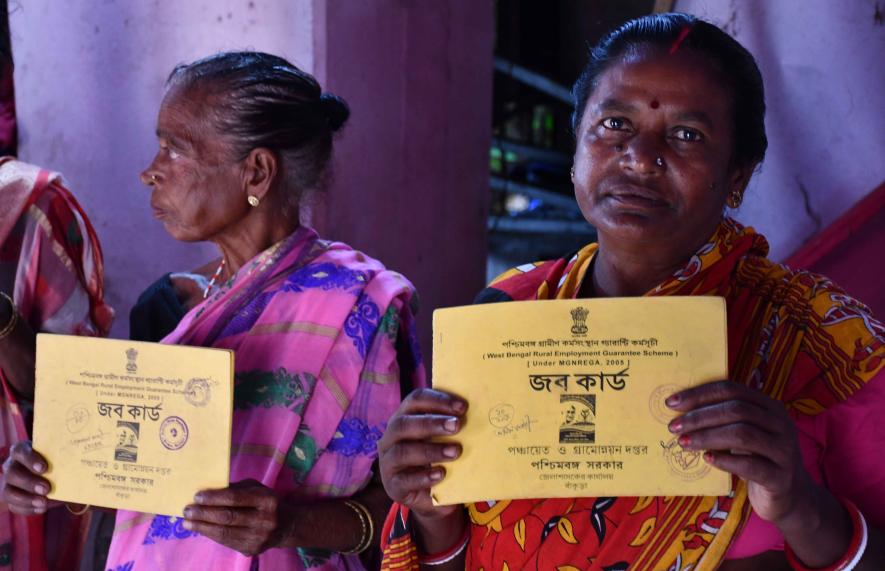 Madhabi and Sarala Bauri showing their MGNREGA job cards at Maliyara Barjora.